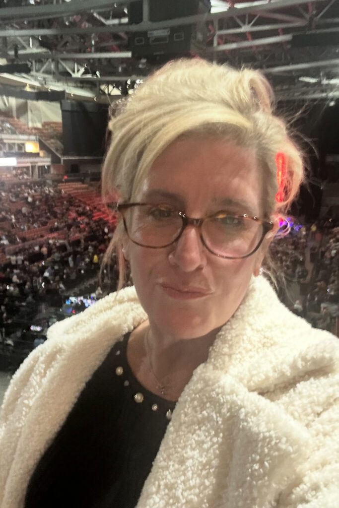 portrait of a strong, bold woman looking sassy at an event
