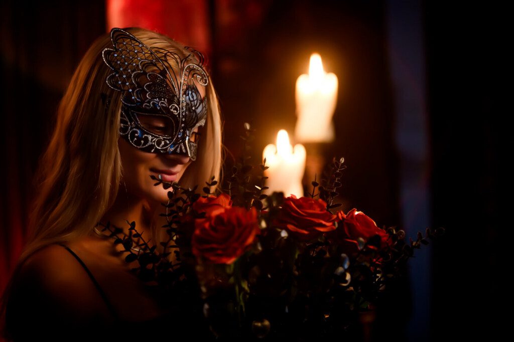 Woman wearing a mask during an Alter Ego boudoir session at The Pouting Room in Marion, Massachusetts